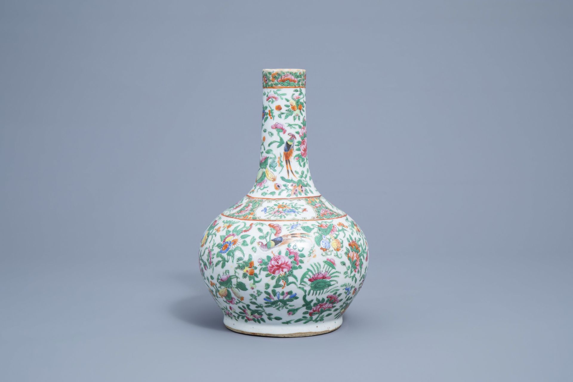 A Chinese Canton famille rose bottle vase with floral design, 19th C. - Image 2 of 7