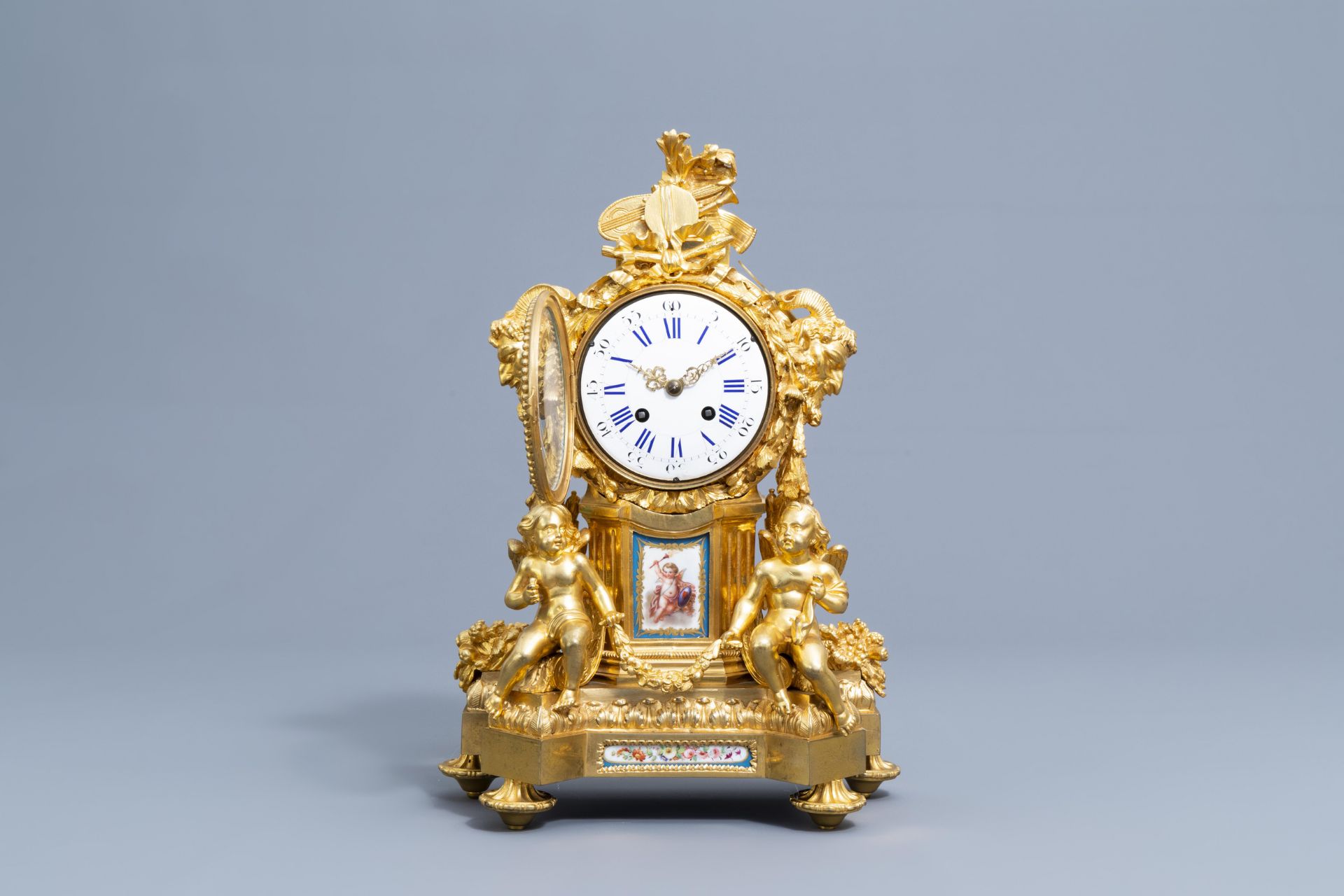 A French gilt bronze mounted Sevres style clock and a pair of Louis XV style candelabra, 19th C. - Image 3 of 23