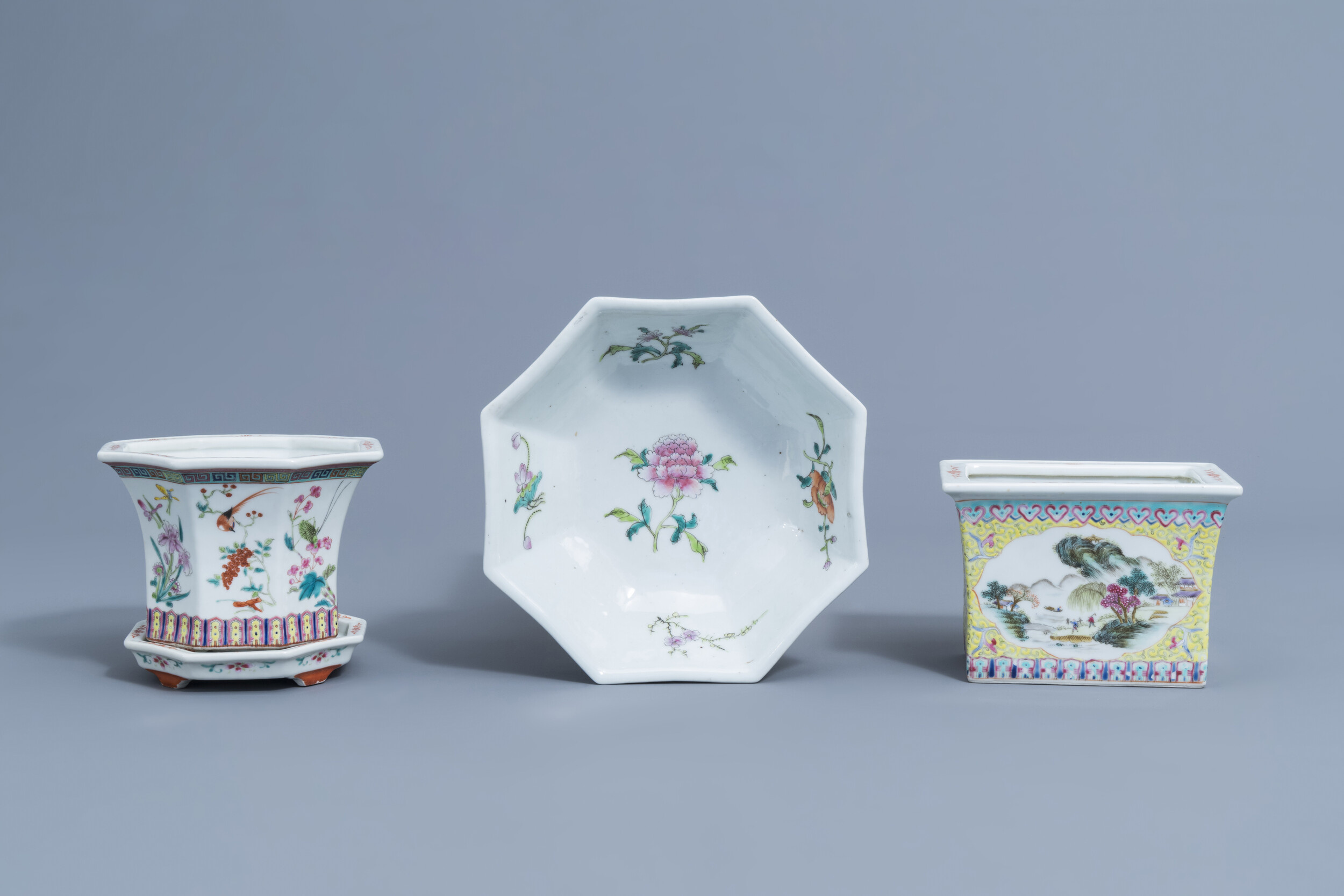 Two Chinese famille rose jardinires and a bowl with floral design, 20th C.