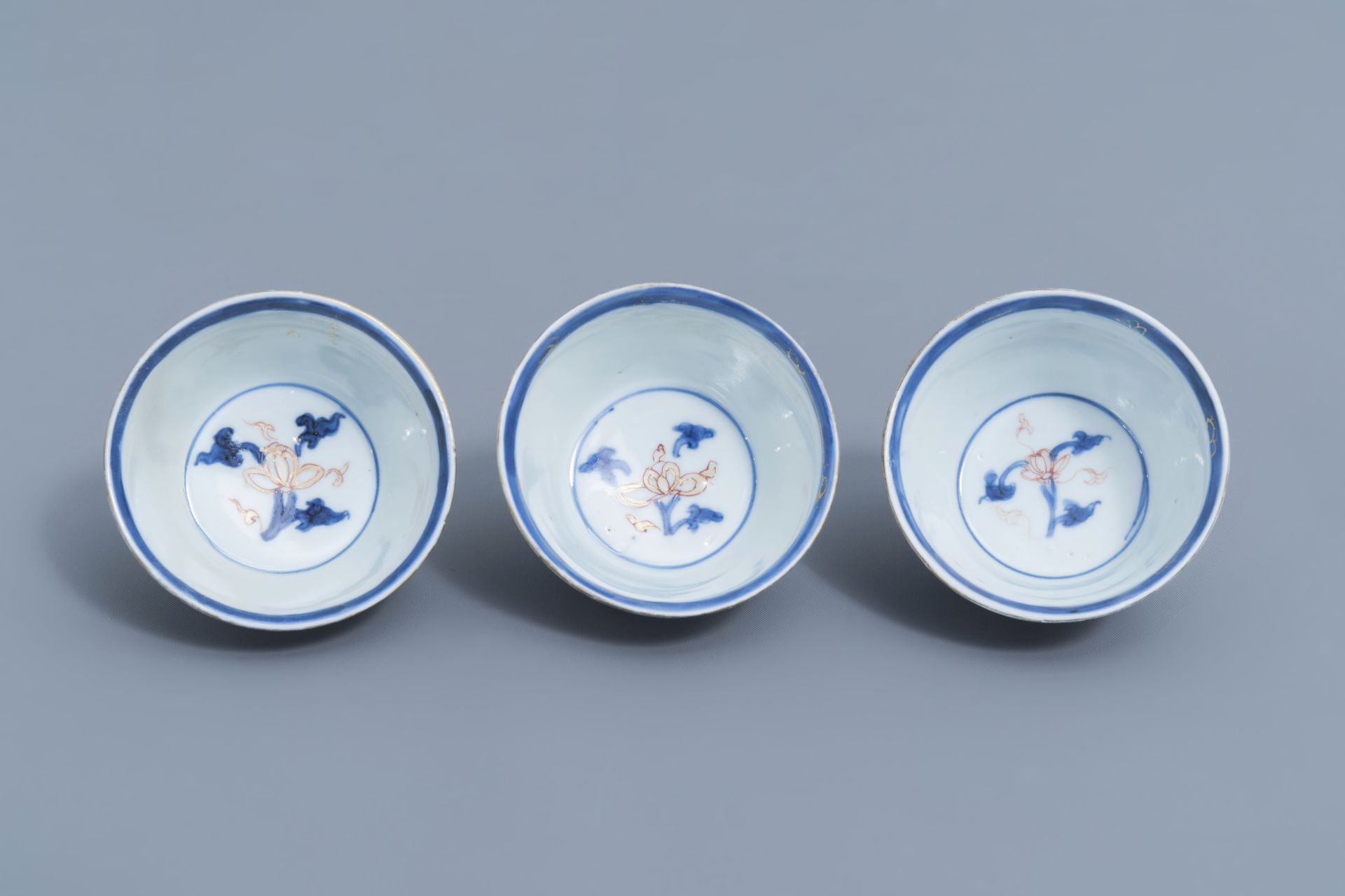 Six Chinese blue, white, iron red and gilt cups and saucers with floral design, Kangxi - Image 22 of 34