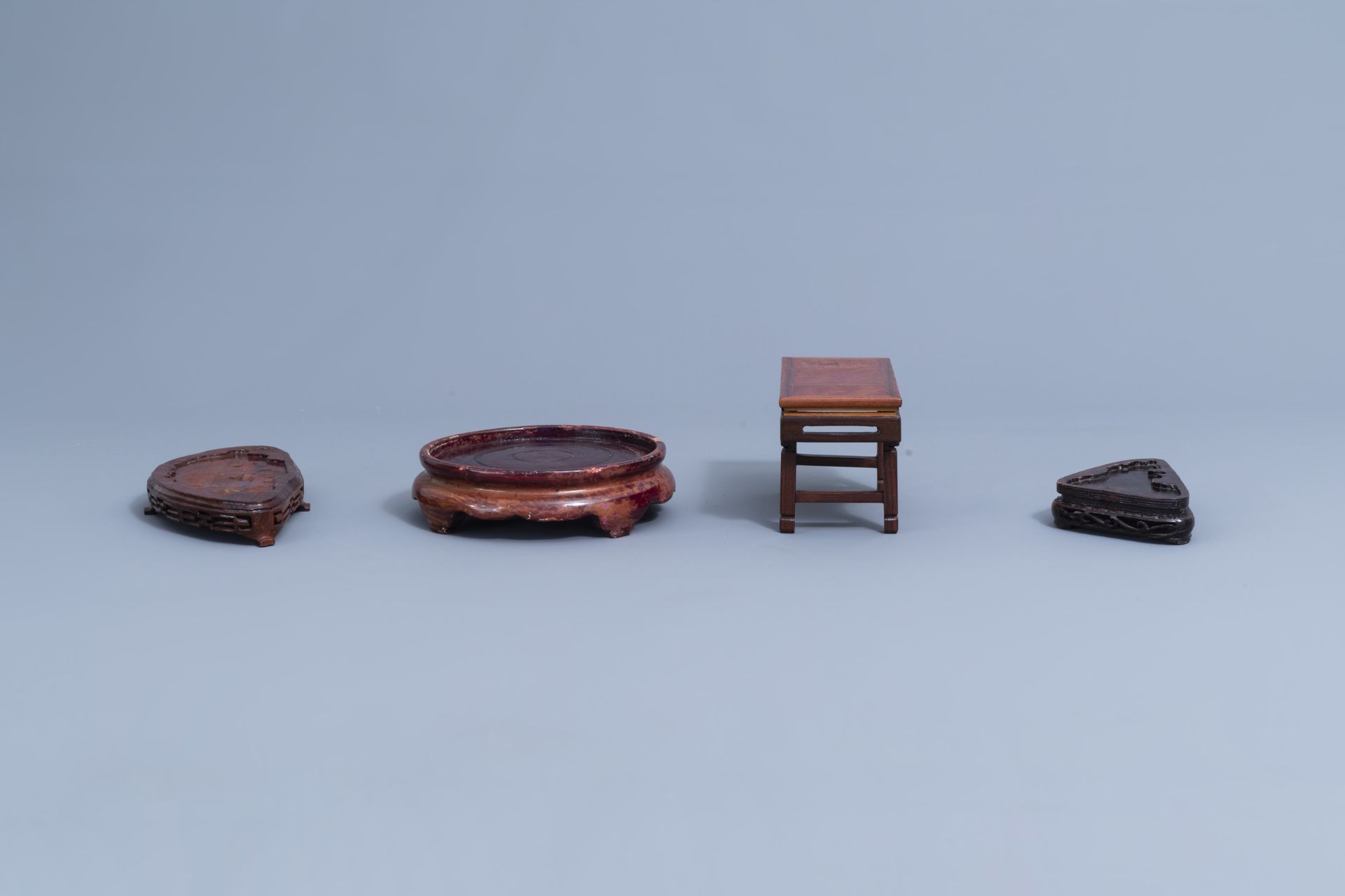 A collection of Chinese carved wooden stands, 19th/20th C. - Image 24 of 32