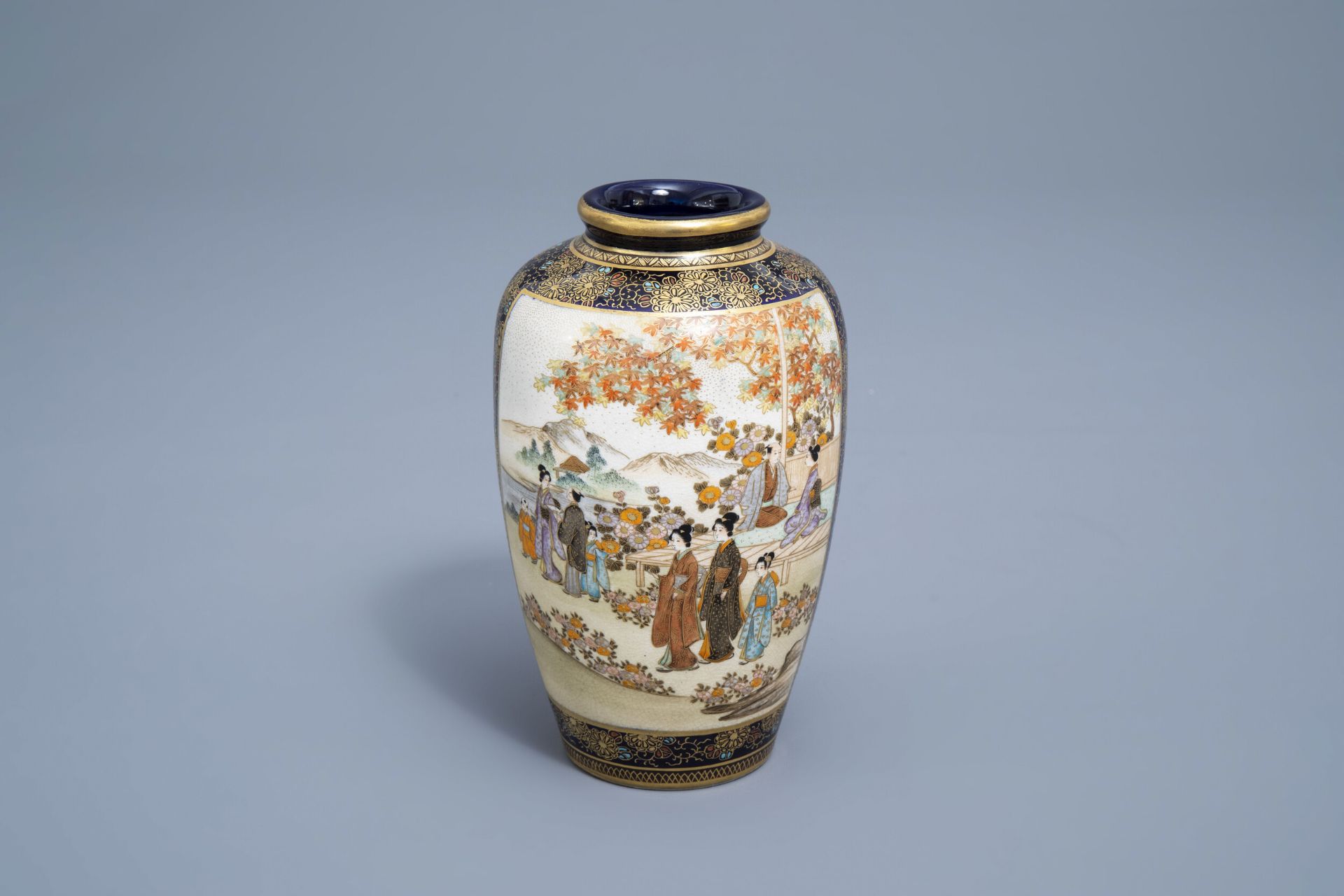 A Japanese Satsuma vase with figures and a landscape, Kinkozan mark, Meiji, 19th C.