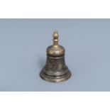 An Islamic silver inlaid bronze table bell, 17th/18th C.