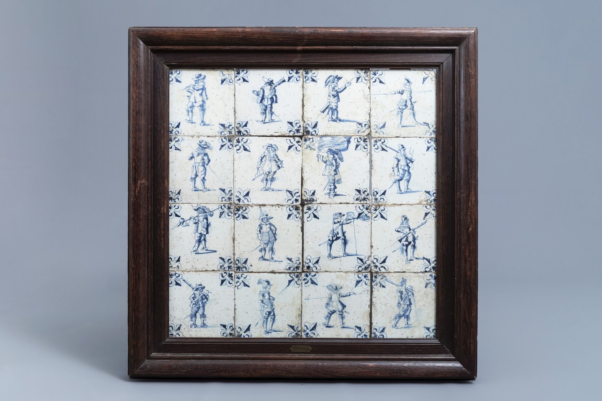 Sixteen Dutch Delft blue and white tiles with soldiers, 17th C.