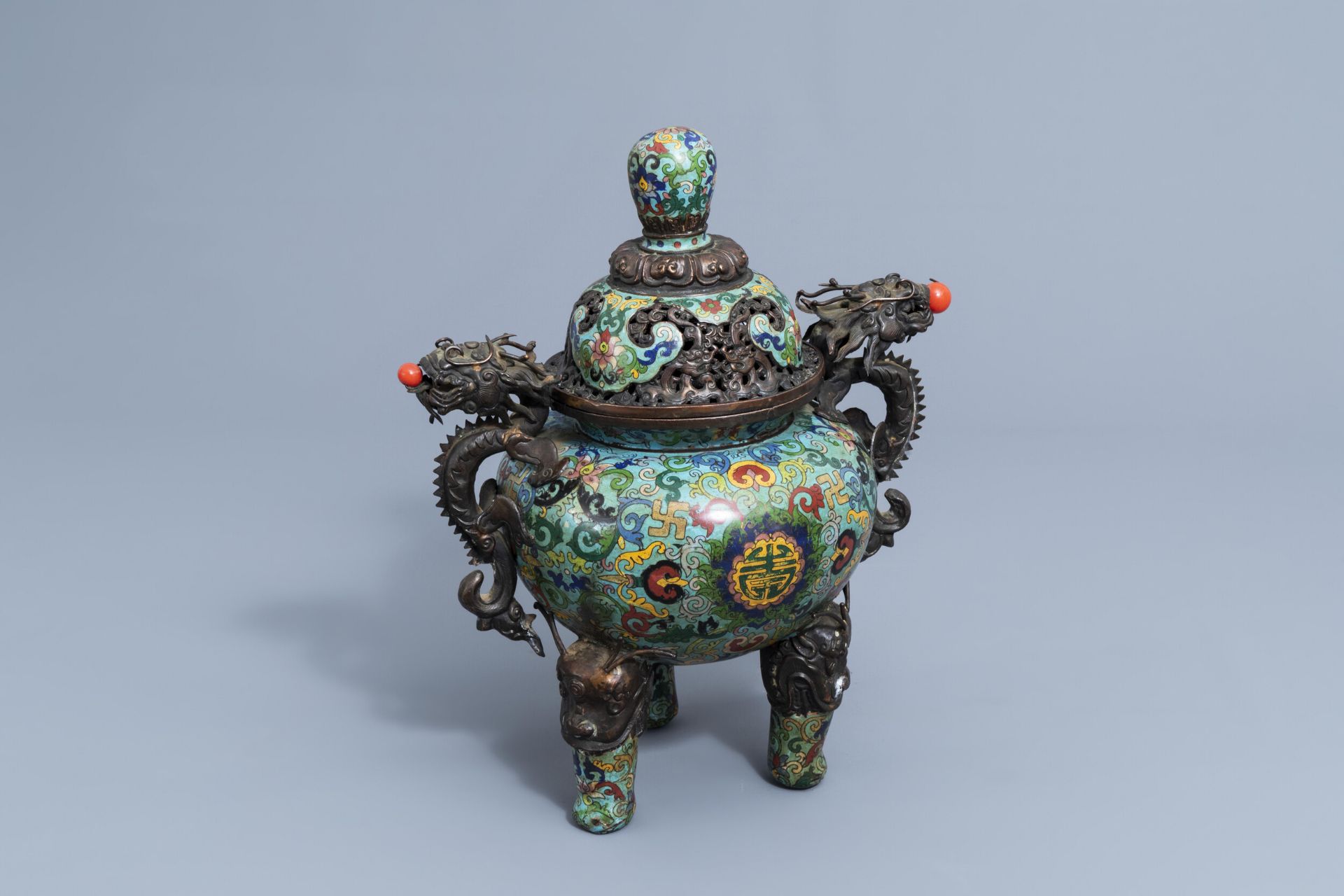 A Chinese cloisonne tripod incense burner and cover with dragon relief design, 20th C.