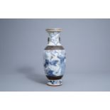 A Chinese blue and white Nanking crackle glazed vase with peacocks, 19th C.