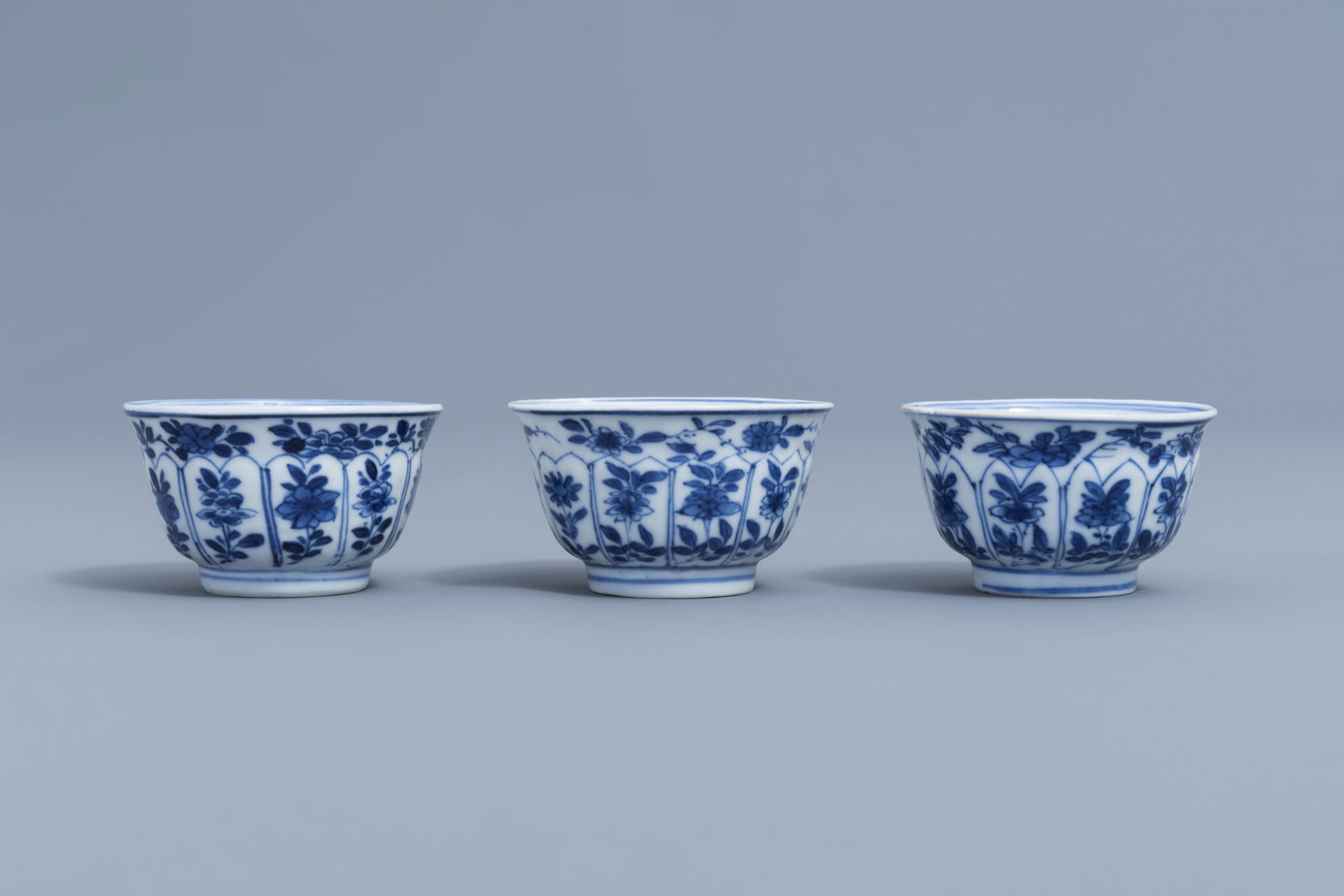 Three Chinese blue and white cups and saucers with floral design, Kangxi - Image 7 of 9