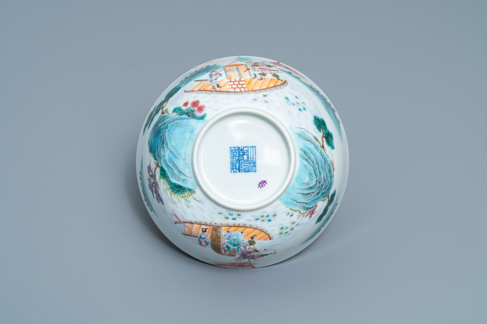 A fine Chinese famille rose bowl with figures in a river landscape, Qianlong mark, 20th C. - Image 7 of 7