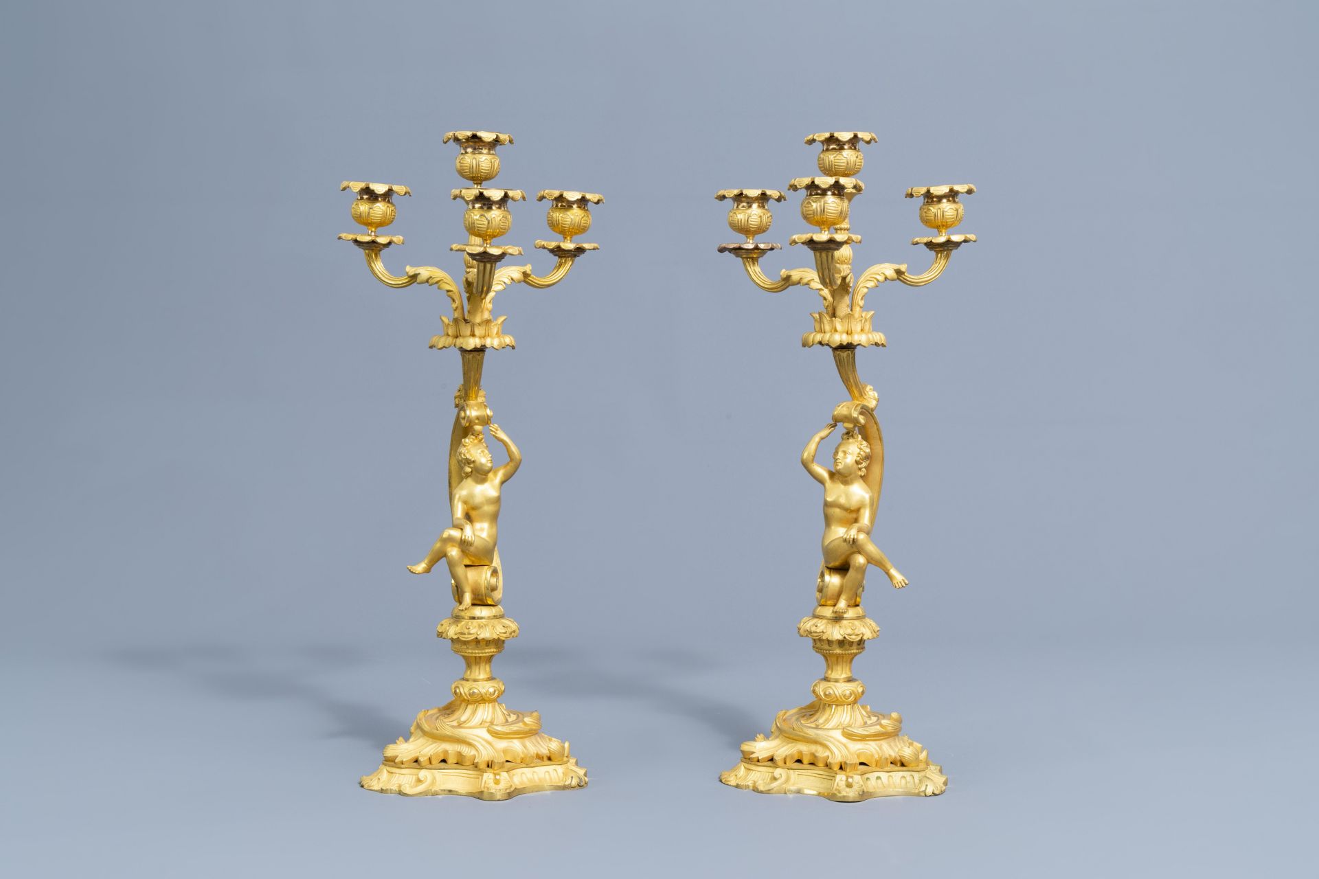 A French gilt bronze mounted Sevres style clock and a pair of Louis XV style candelabra, 19th C. - Image 18 of 23