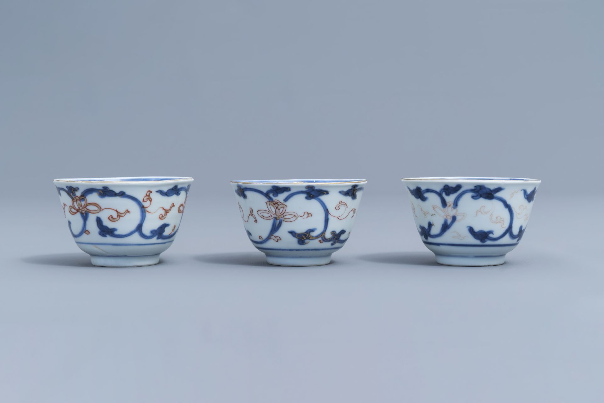 Six Chinese blue, white, iron red and gilt cups and saucers with floral design, Kangxi - Image 25 of 34