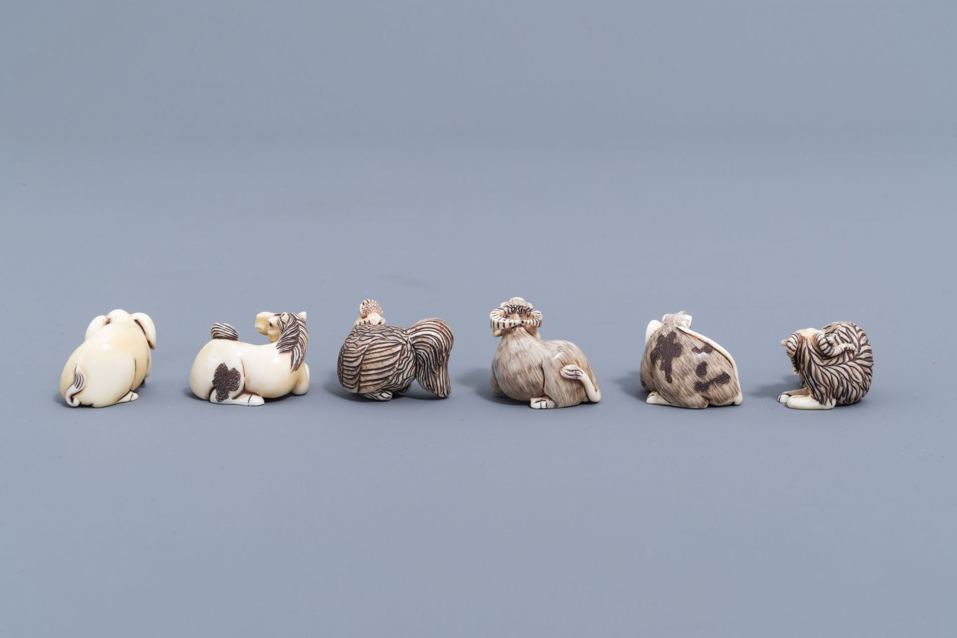 Twelve Japanese animal shaped netsuke in their display cabinet, first half of the 20th C. - Image 17 of 27