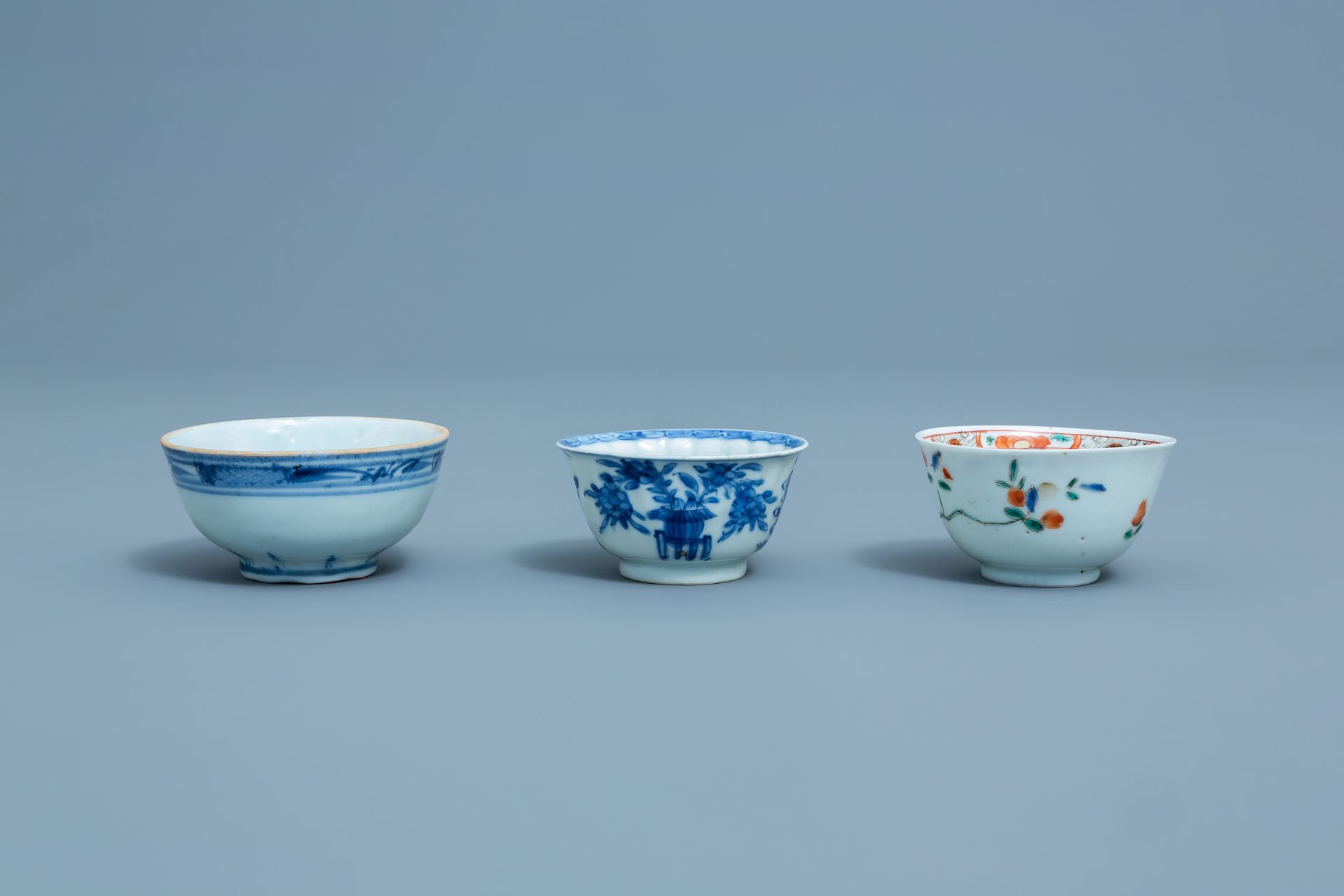 Three Chinese blue, white and famille rose cups and three saucers, Kangxi and later - Image 12 of 18