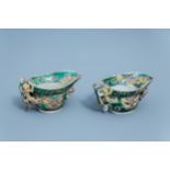 A pair of Chinese verte biscuit libation cups, Kangxi