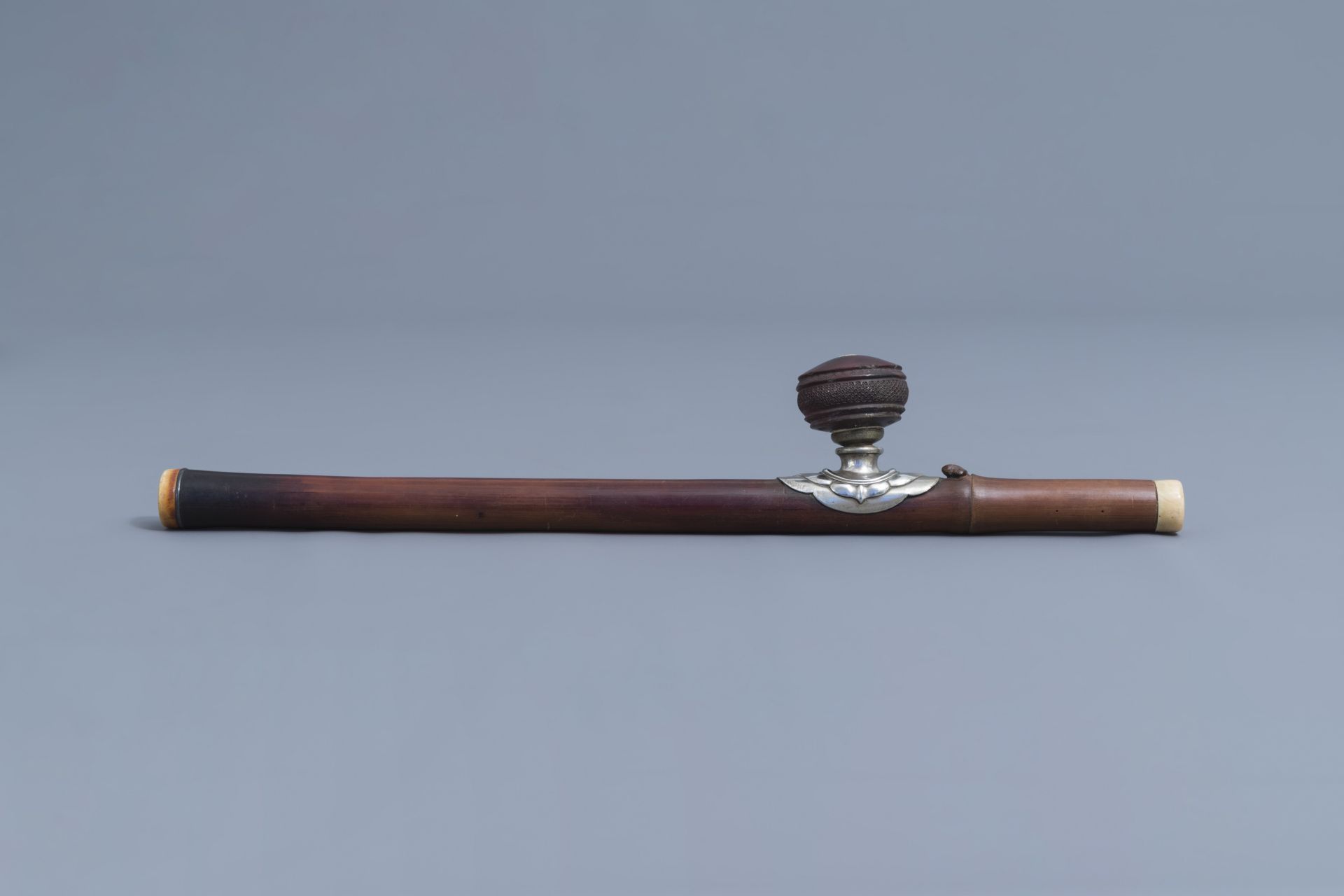 A Chinese bamboo opium pipe, an ivory mouth- and endpiece and a stoneware damper, 19th C. - Image 3 of 9