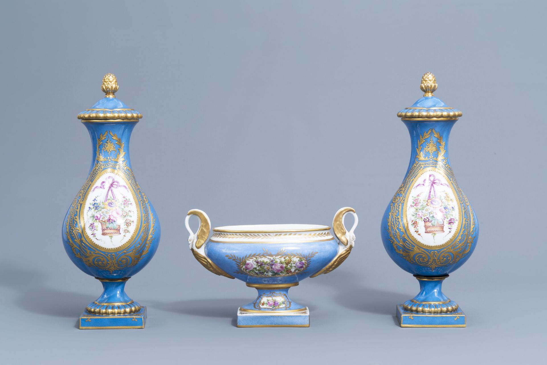 A pair of French 'bleu celeste' Svres manner vases and an Empire style centrepiece, 19th/20th C.