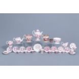 A varied collection of English pink lustreware items with a cottage in a landscape, 19th C.