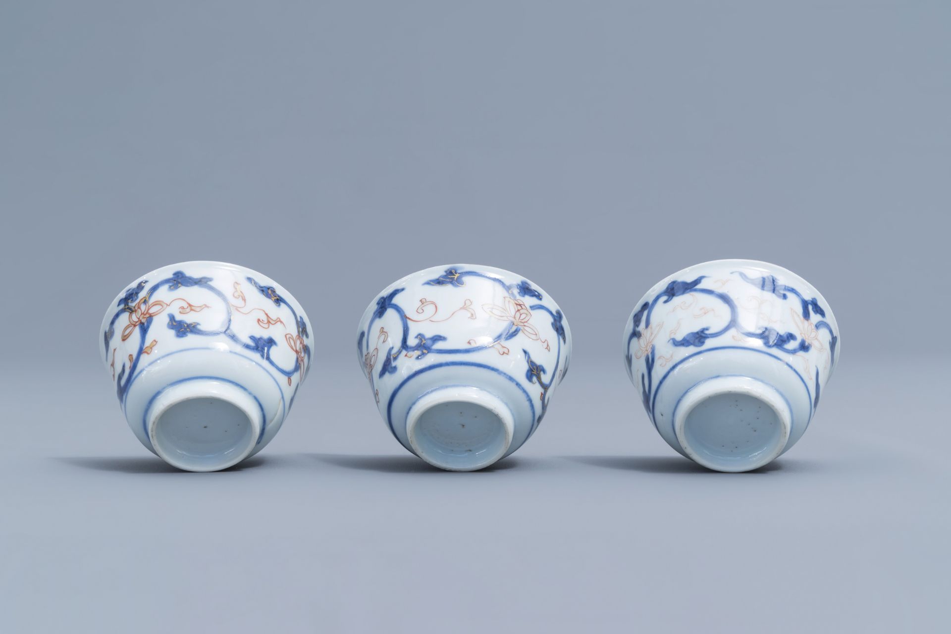 Six Chinese blue, white, iron red and gilt cups and saucers with floral design, Kangxi - Image 32 of 34