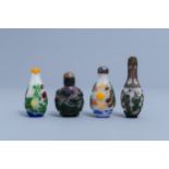 Eight Chinese multi-colour overlay glass snuff bottles, 20th C.