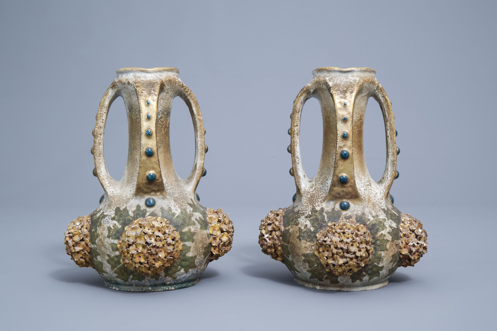 A pair of polychrome, gilt and iridescent Amphora Austria Art Nouveau vases, early 20th C. - Image 3 of 20