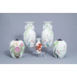 Four Chinese famille rose vases and an iron red vase with lions, 19th/20th C.