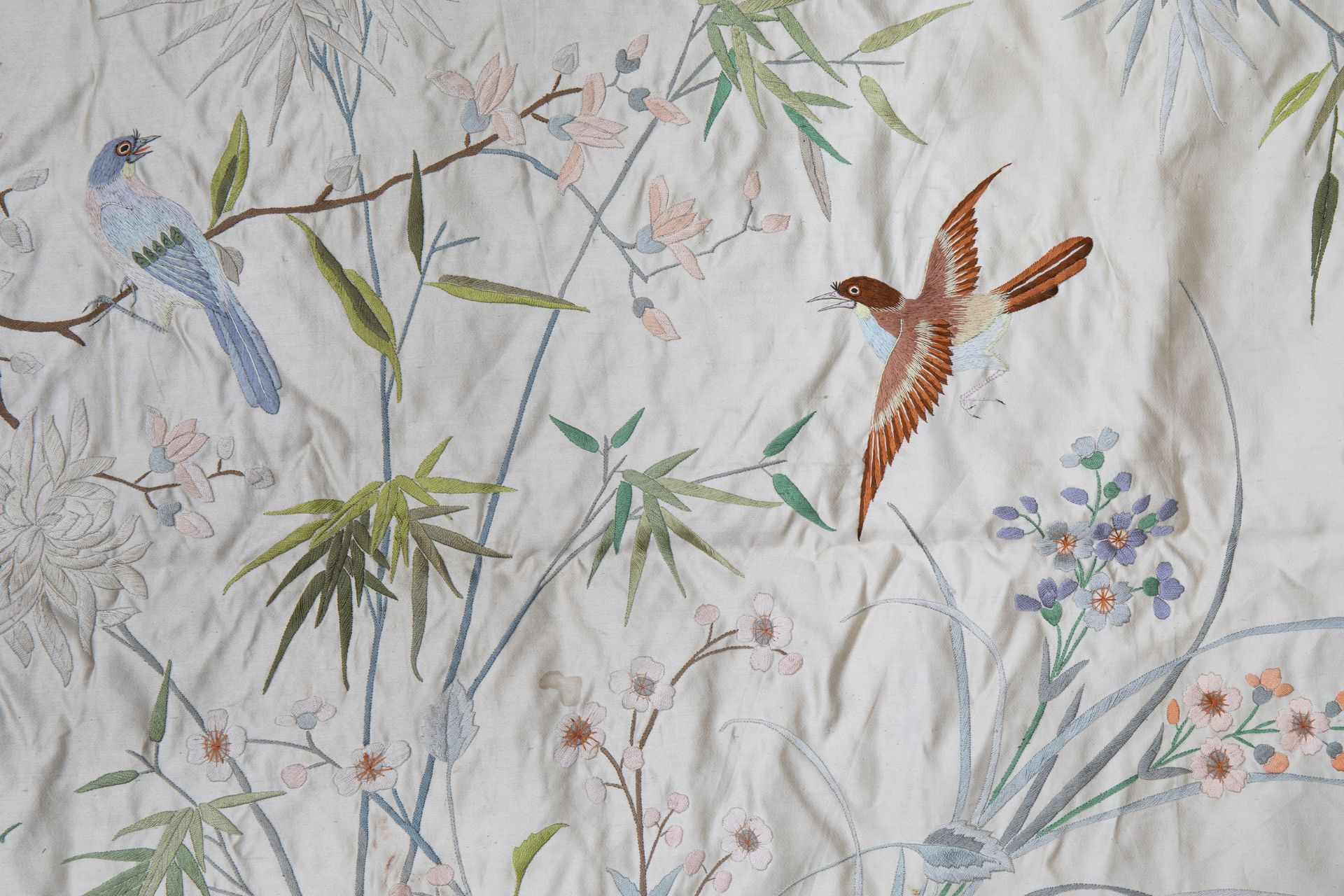 A Chinese horizontal silk embroidery with birds and a butterfly among flower branches, 19th C. - Image 5 of 5