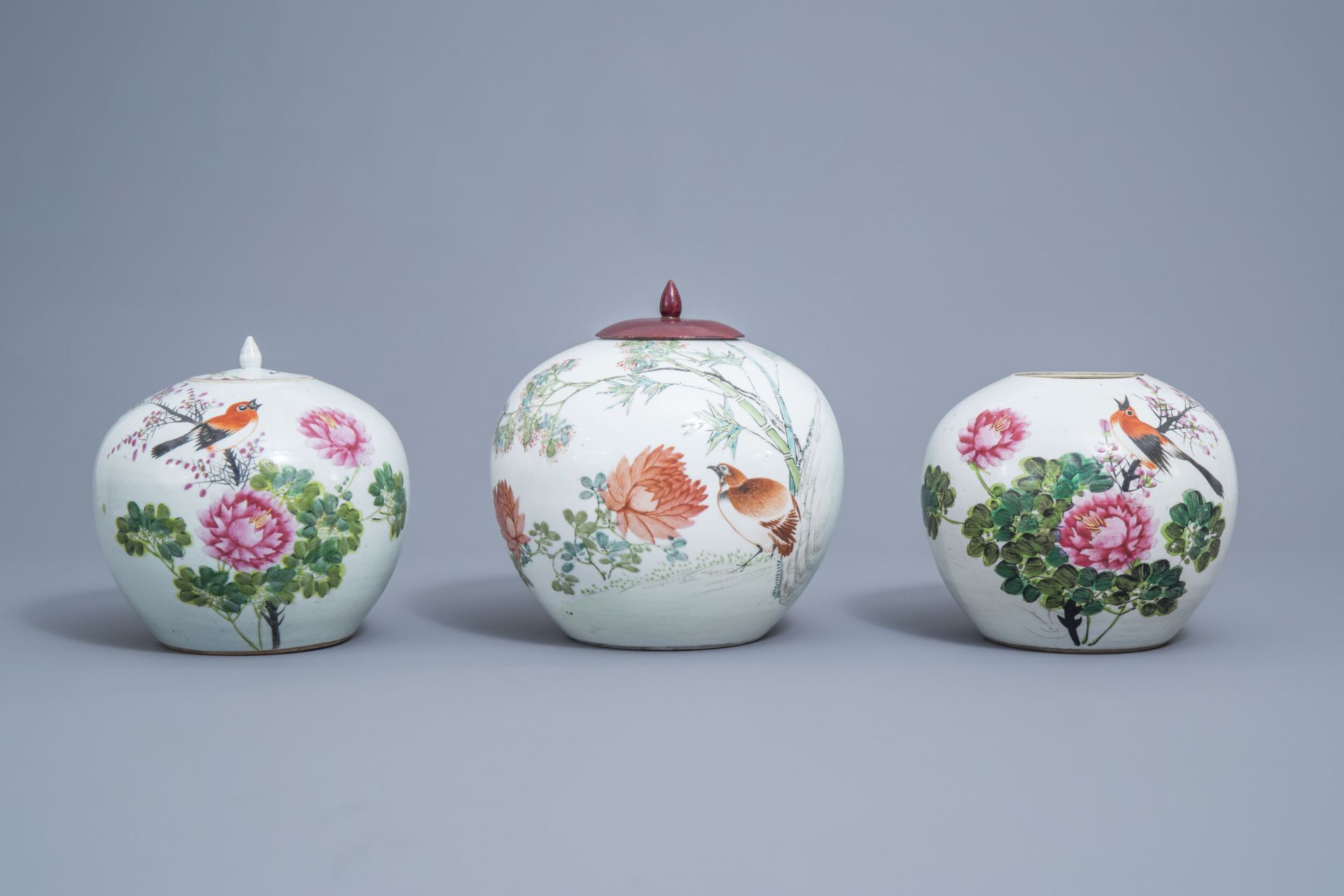 Two Chinese qianjiang cai jars and covers and a jar with a bird, 19th/20th C.