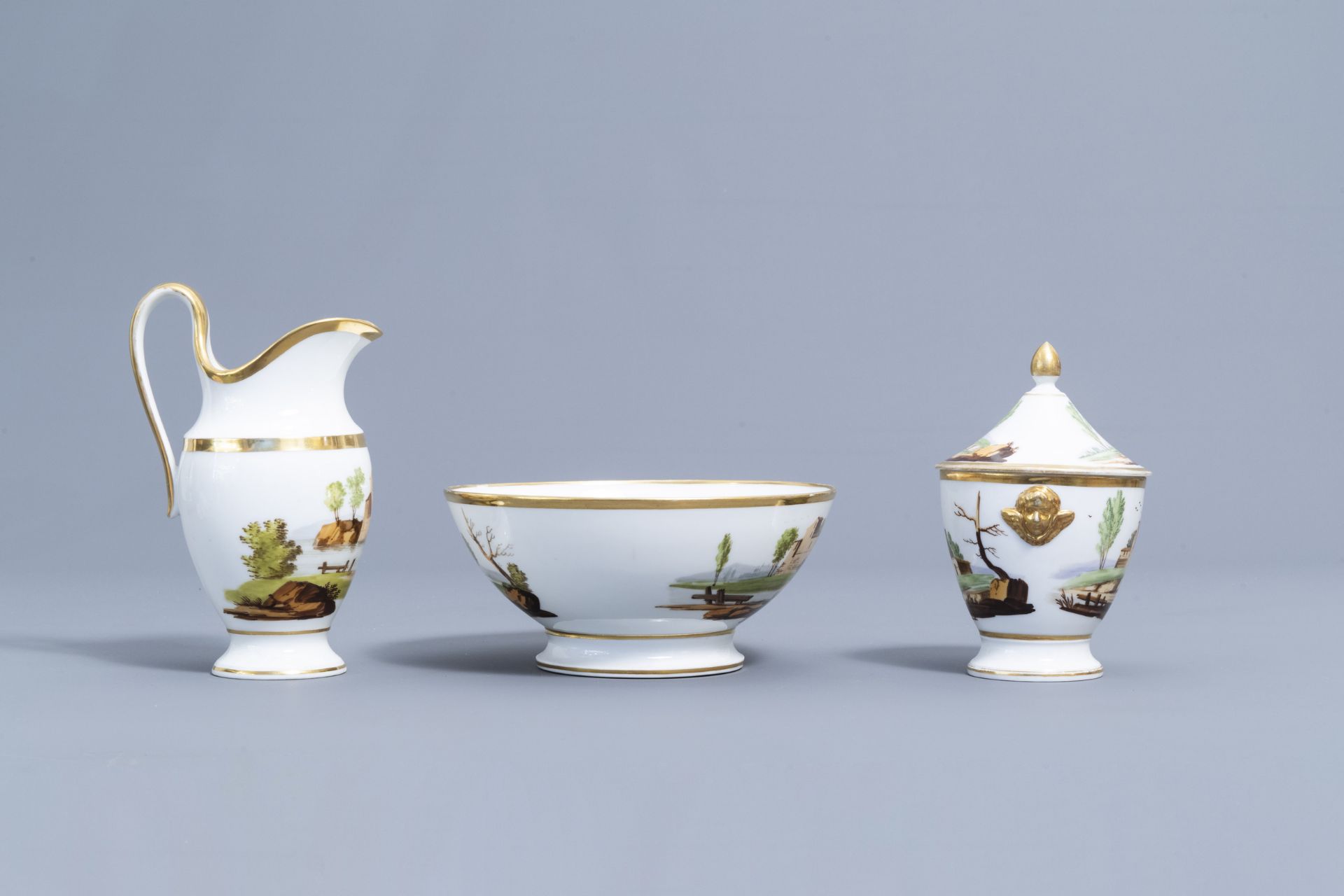 A 21-piece Paris polychrome and gilt porcelain coffee and tea service with landscapes, 19th C. - Image 17 of 46