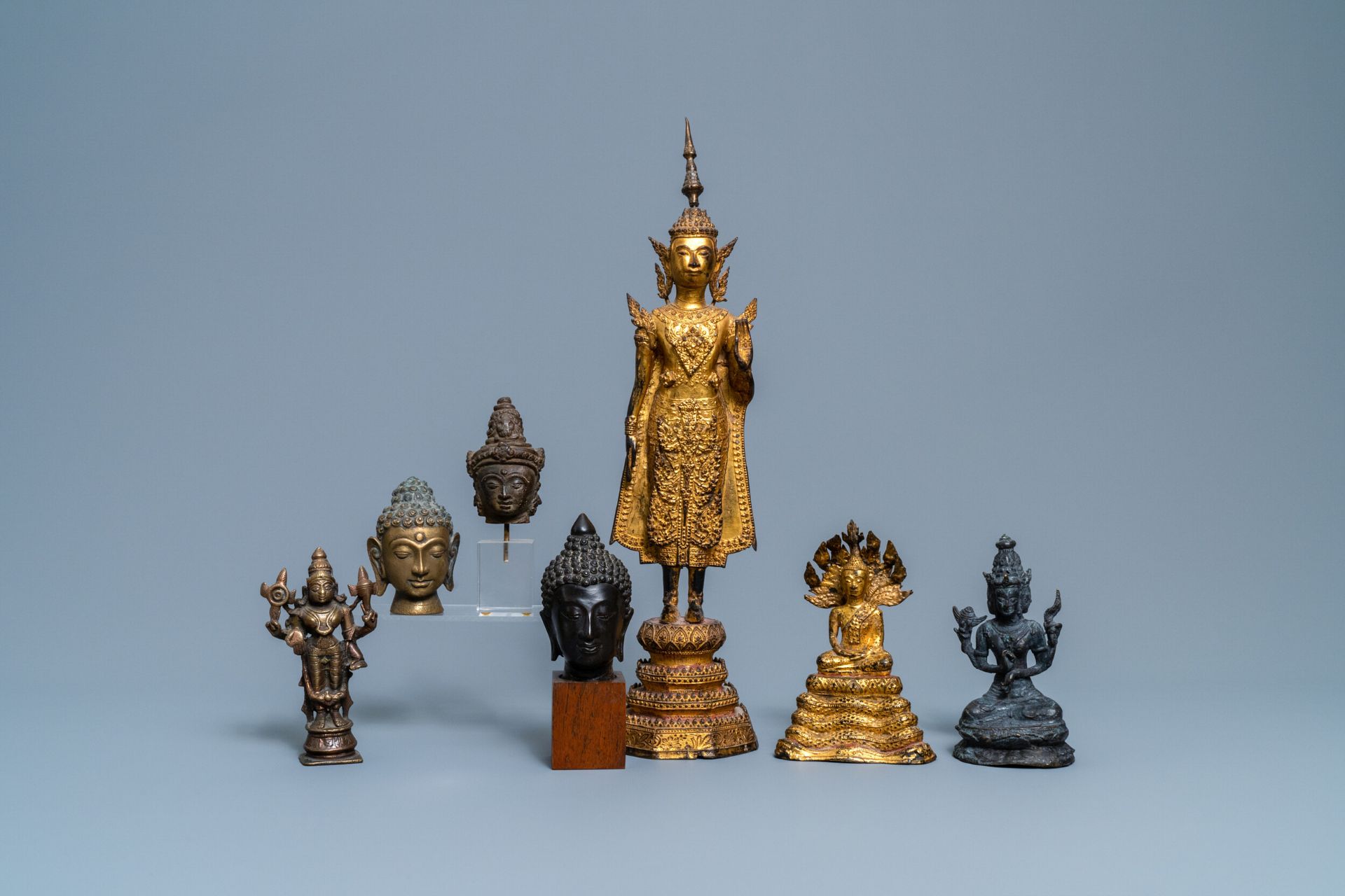 A collection of bronze figures and fragments, India, Thailand and Tibet, 19th C. and earlier