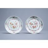 A pair of Chinese famille rose plates with fish and floral design, Qianlong