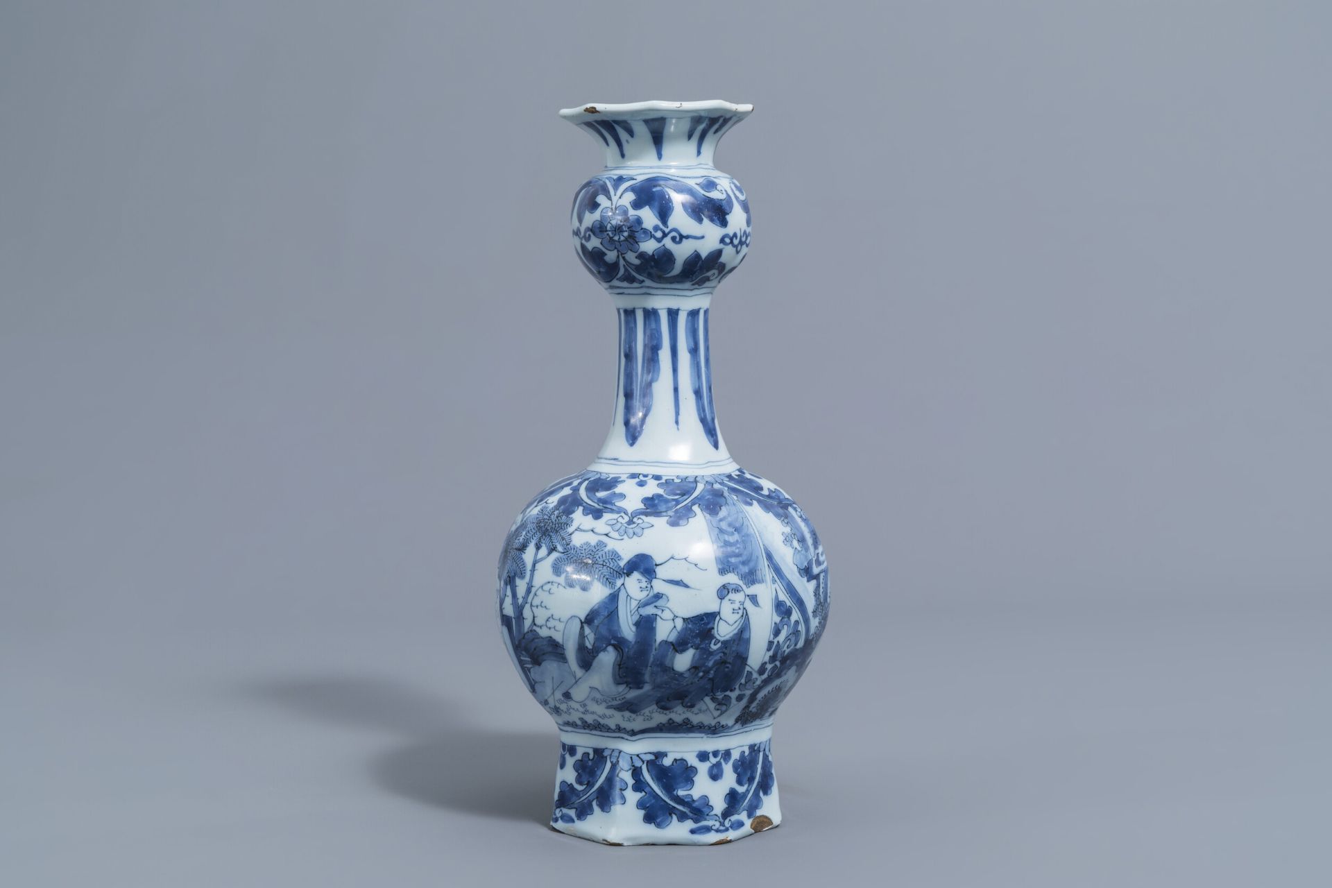 A Dutch Delft blue and white 'chinoiserie' garlic neck bottle vase, late 17th C.