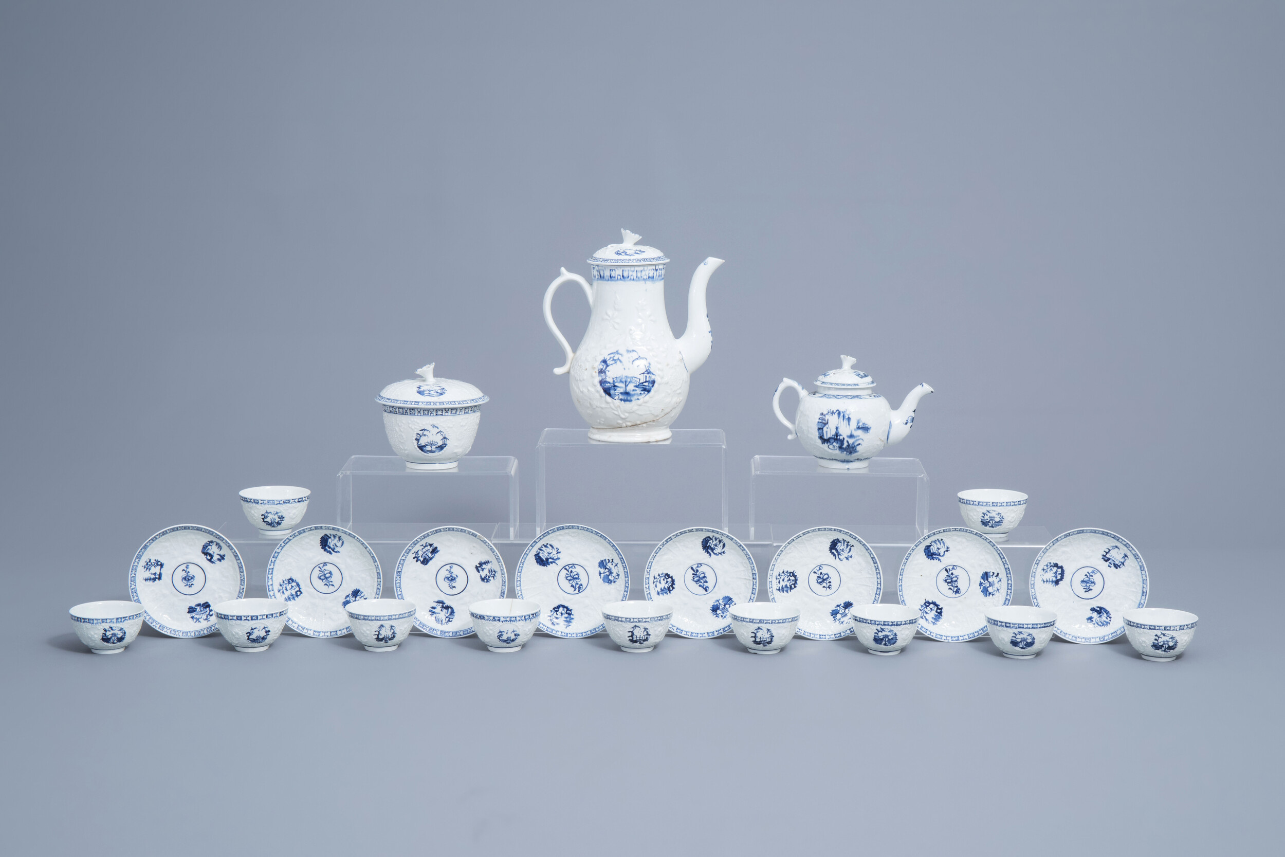 An English 22-piece blue and white Lowestoft creamware 'Hughes' coffee and tea service, 18th C.