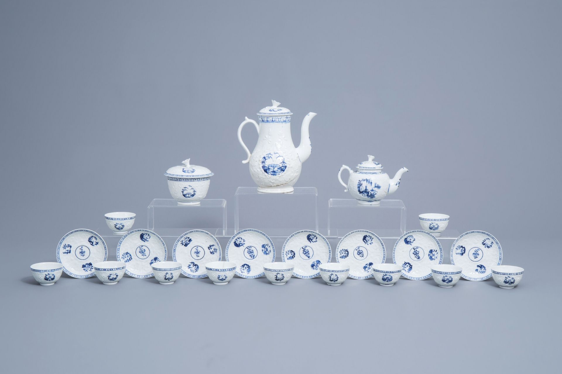 An English 22-piece blue and white Lowestoft creamware 'Hughes' coffee and tea service, 18th C.