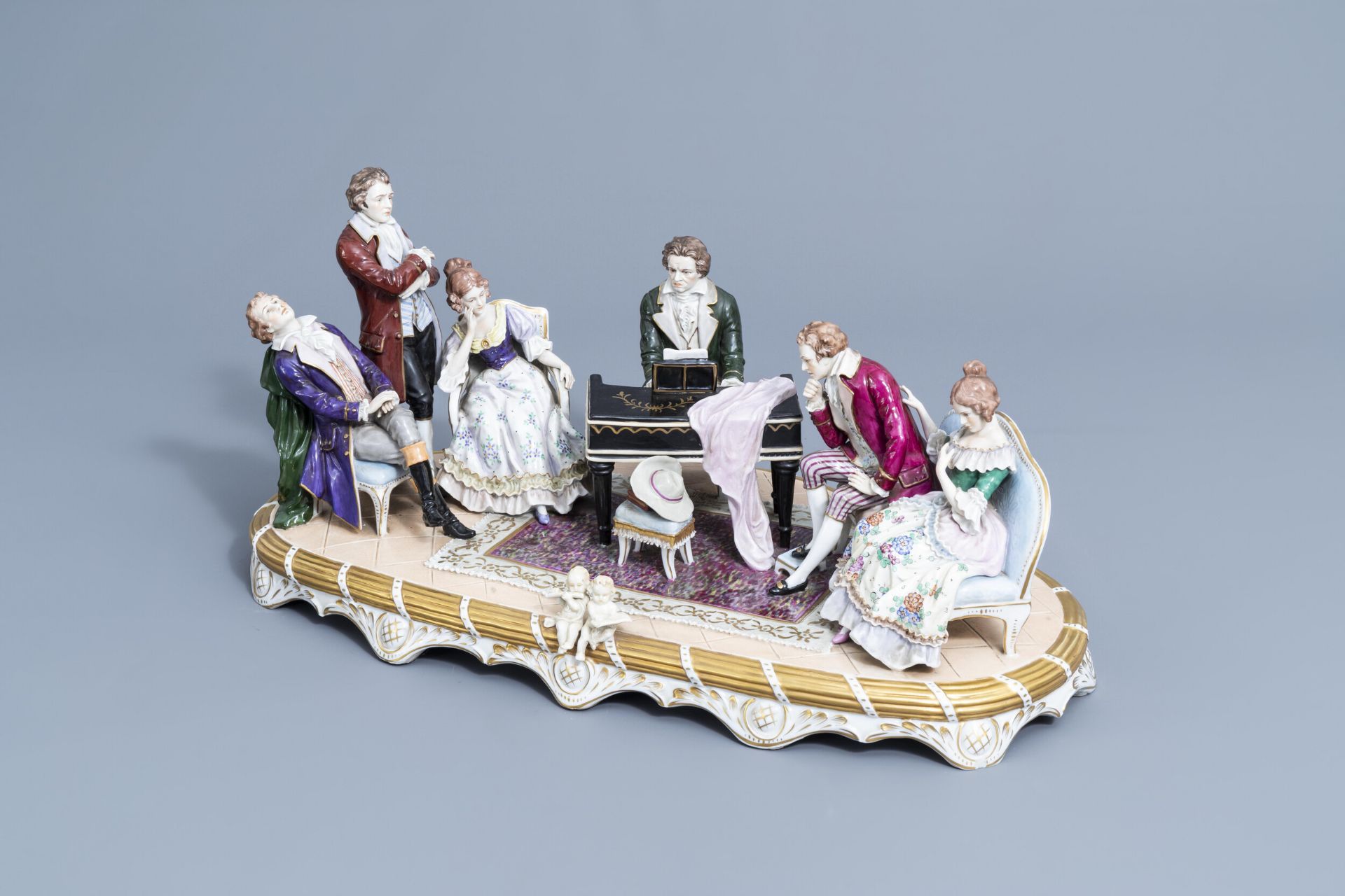 A group with a piano concerto in polychrome decorated Saxon porcelain, Sitzendorf mark, 20th C.