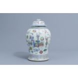 A Chinese famille rose 'antiquities' vase and cover, 19th C.