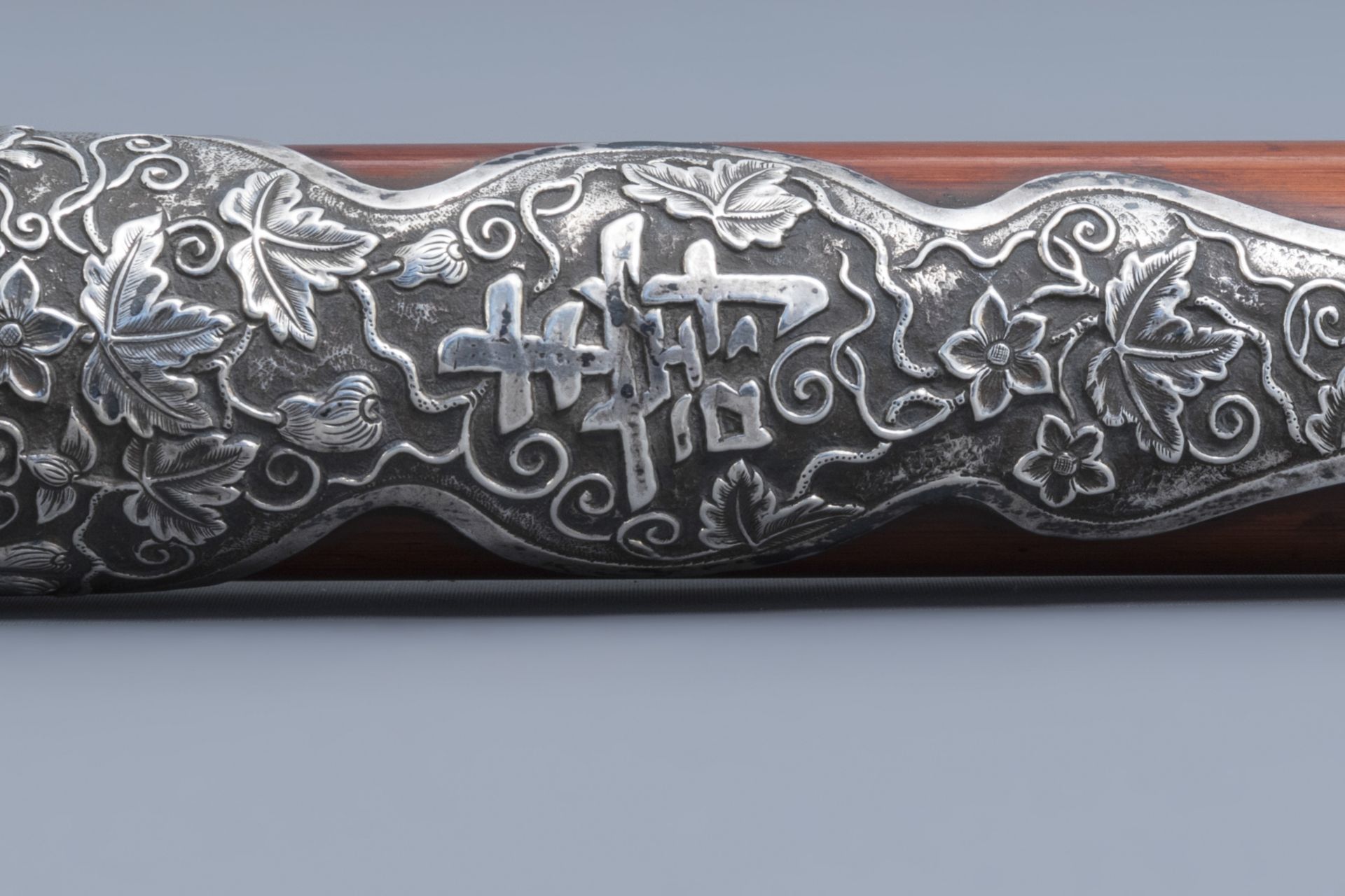 A Chinese bamboo opium pipe with a silver saddle, ivory endpiece and stoneware damper, 19th C. - Image 8 of 12