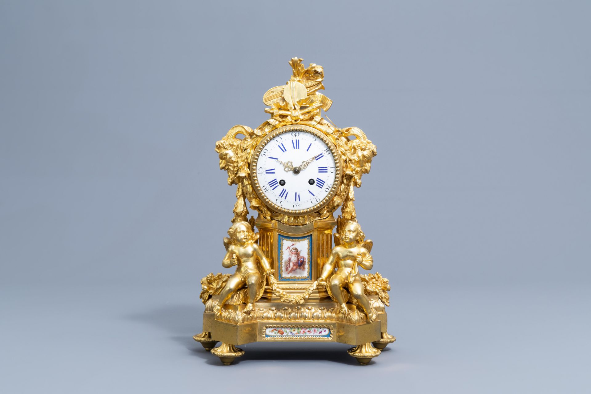 A French gilt bronze mounted Sevres style clock and a pair of Louis XV style candelabra, 19th C. - Image 2 of 23