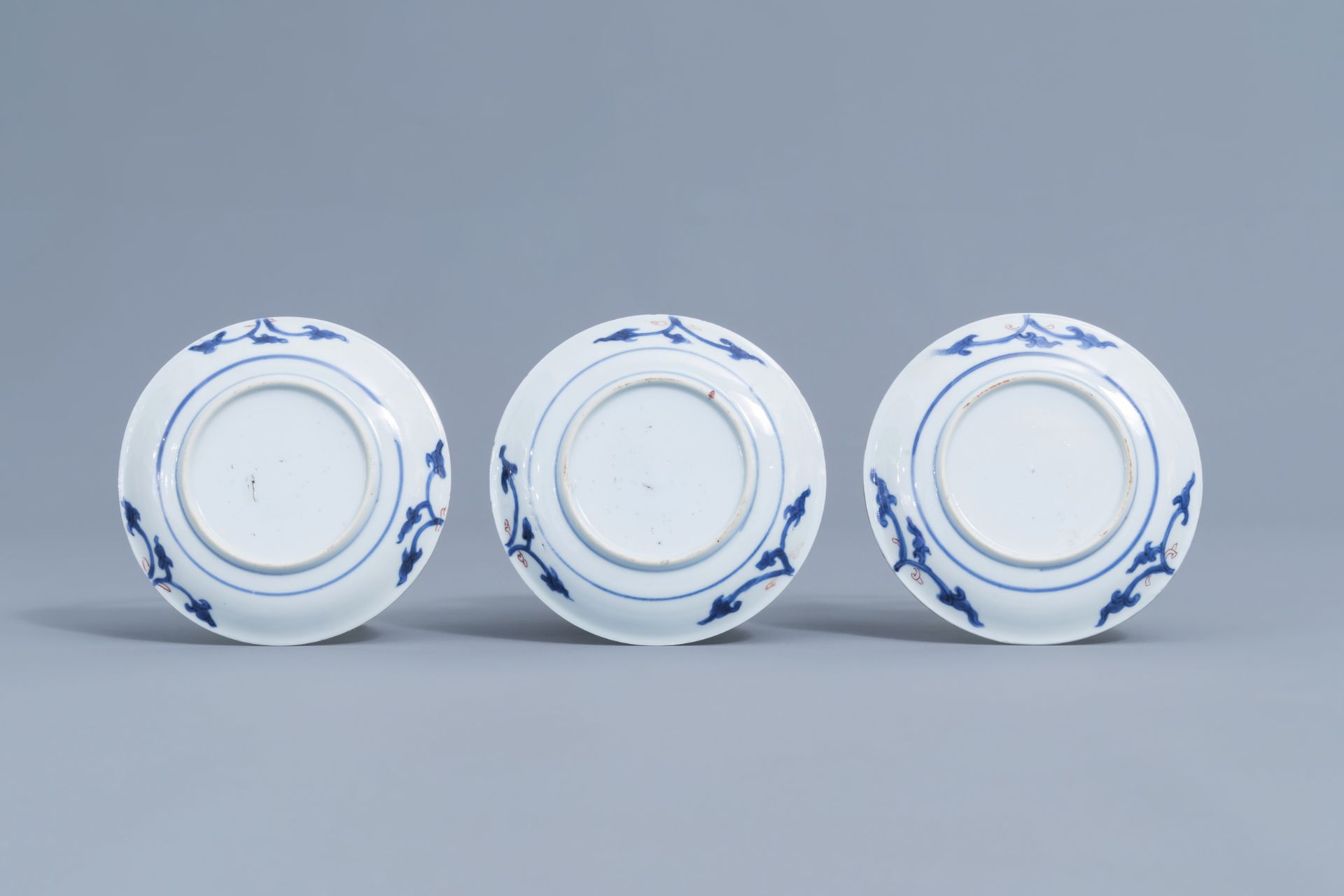 Six Chinese blue, white, iron red and gilt cups and saucers with floral design, Kangxi - Image 5 of 34
