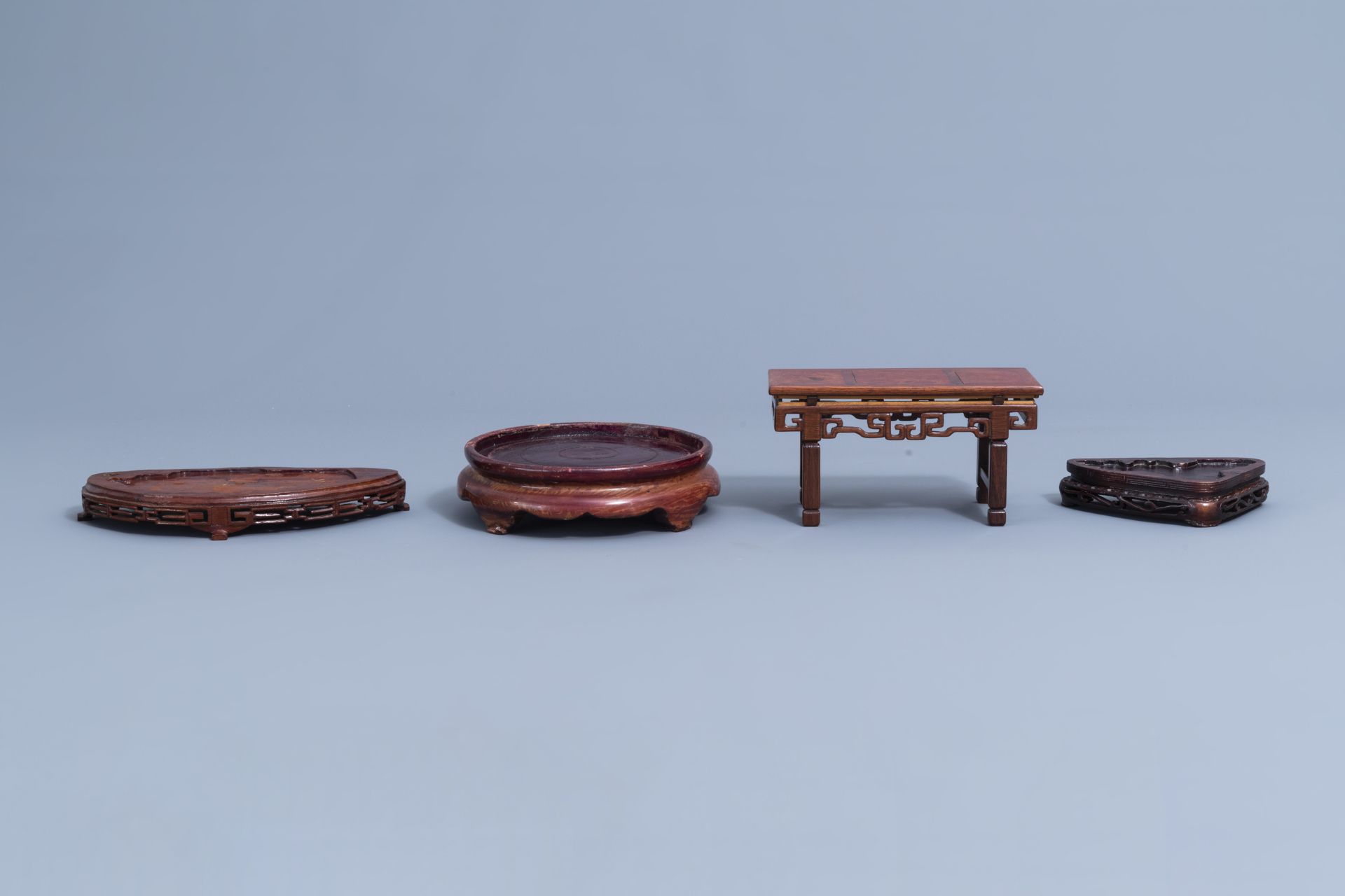 A collection of Chinese carved wooden stands, 19th/20th C. - Image 21 of 32