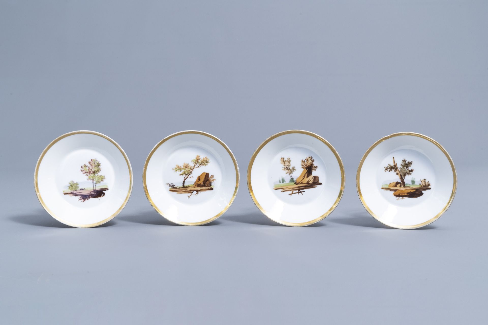 A 21-piece Paris polychrome and gilt porcelain coffee and tea service with landscapes, 19th C. - Image 32 of 46