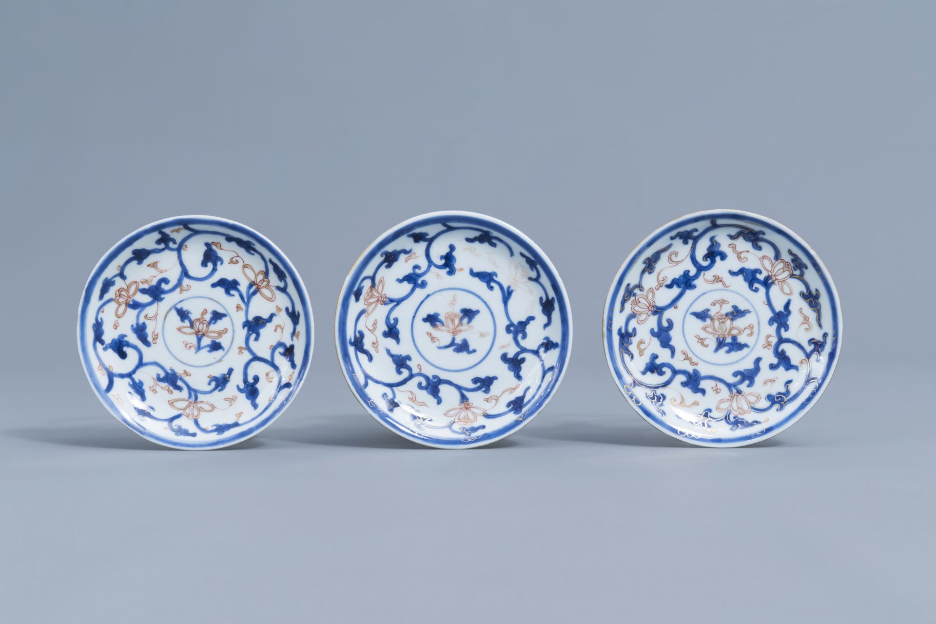 Six Chinese blue, white, iron red and gilt cups and saucers with floral design, Kangxi - Image 4 of 34