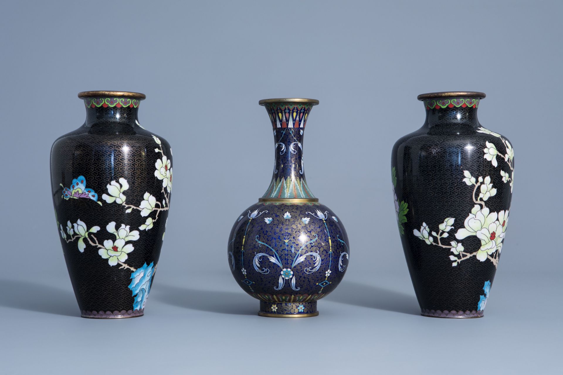 A pair of Chinese cloisonne vases with floral design and a bottle vase, 19/20th C. - Image 3 of 7