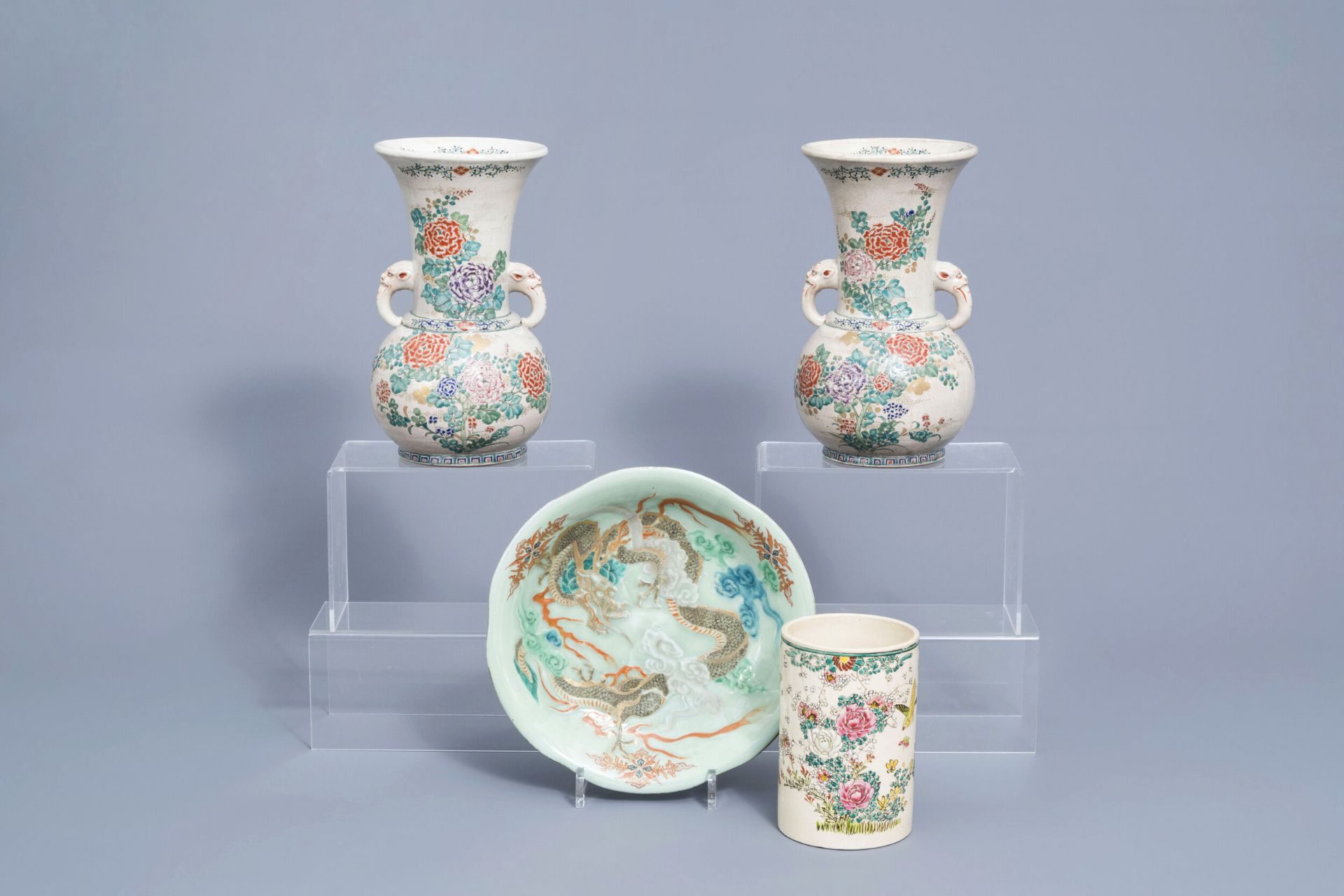 A Japanese celadon 'dragon' dish, a pair of Satsuma vases and a brush pot, Meiji, 19th C.