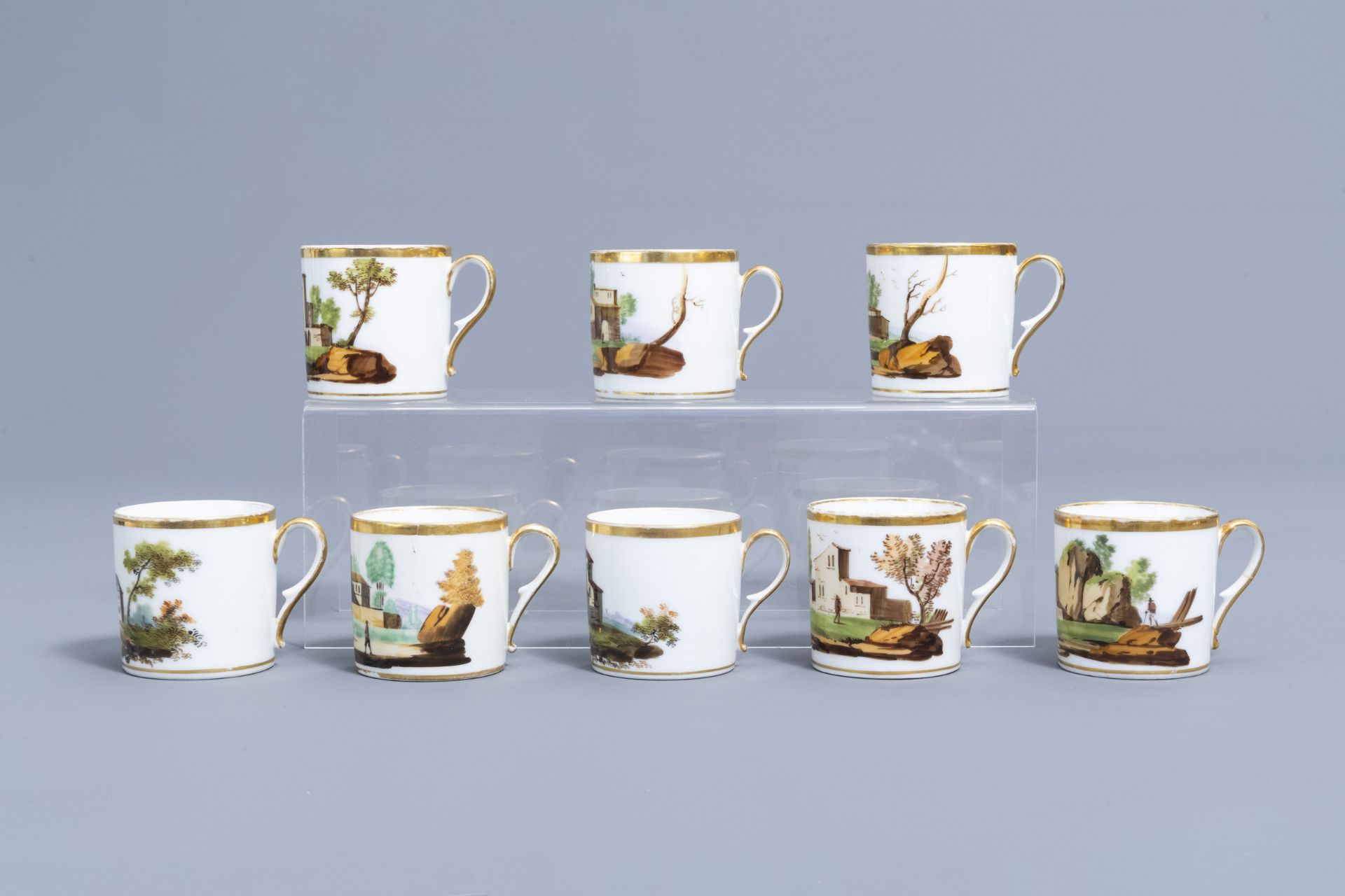 A 21-piece Paris polychrome and gilt porcelain coffee and tea service with landscapes, 19th C. - Image 42 of 46