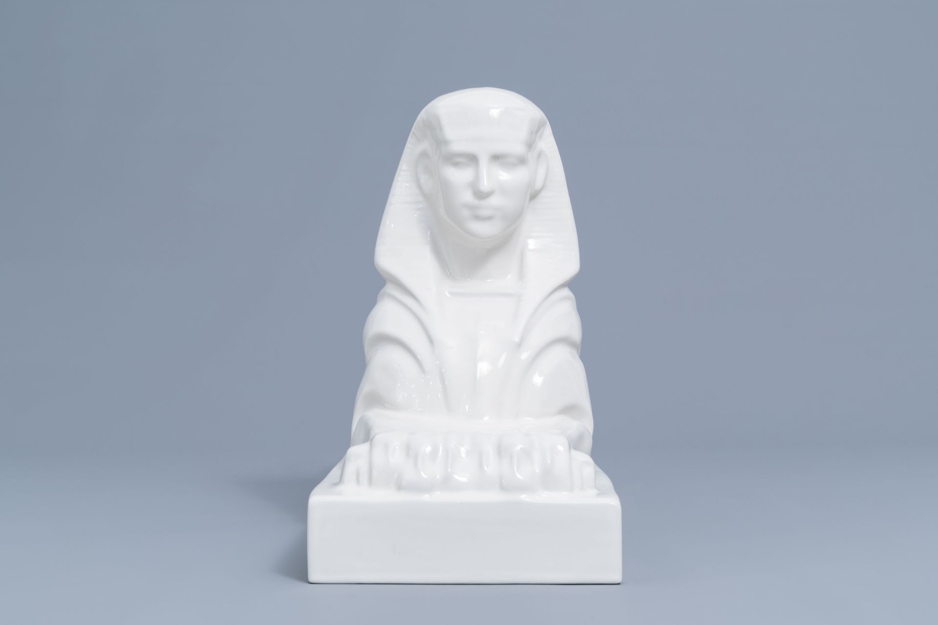 A large white glazed Maastricht earthenware figure of a sphinx, Petrus Regout, first half 20th C. - Image 5 of 8