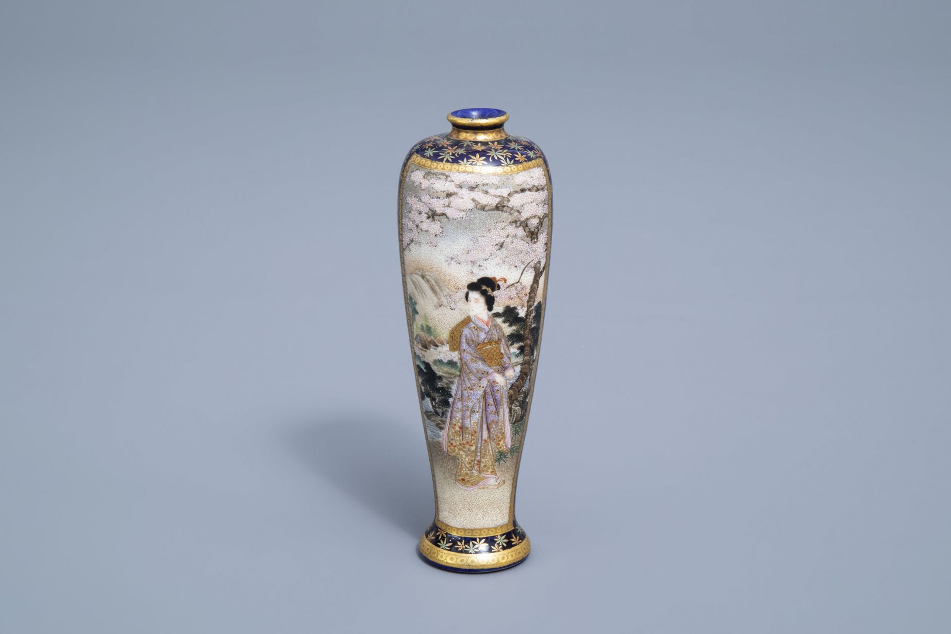 A Japanese Satsuma vase with ladies in a garden, Kinkozan mark, Meiji, 19th C.