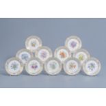 A set of eleven French plates with gilt and polychrome floral design, Svres mark, 19th C.