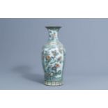 A Chinese famille verte baluster vase with birds among blossoming branches, 19th C.