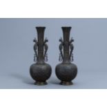 A pair of large Chinese bottle shaped bronze 'phoenixes' vases, 9-character mark, 19th/20th C.