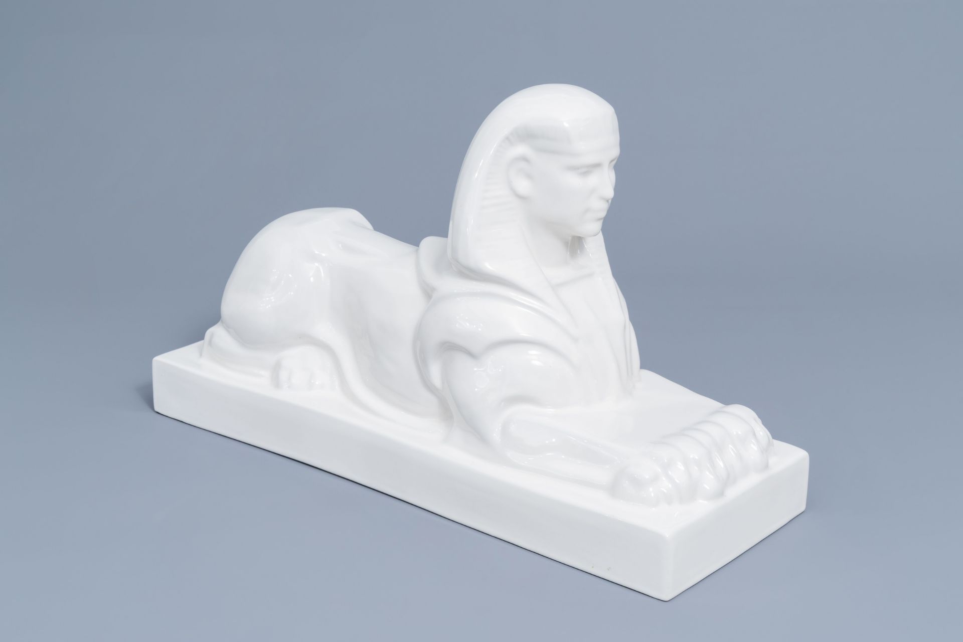 A large white glazed Maastricht earthenware figure of a sphinx, Petrus Regout, first half 20th C. - Image 2 of 8