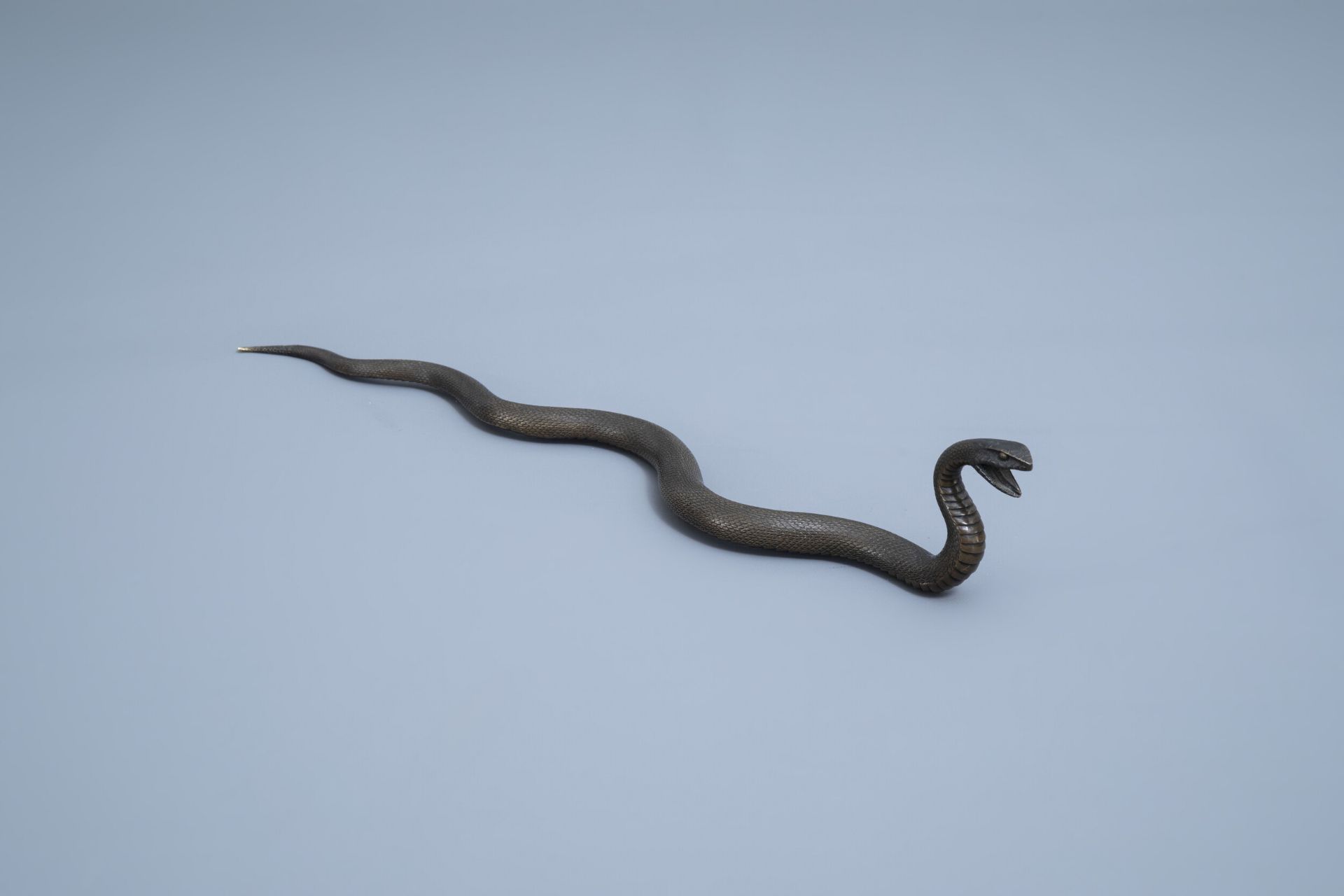 A Japanese bronze sculpture of a snake in an attack position, Meiji